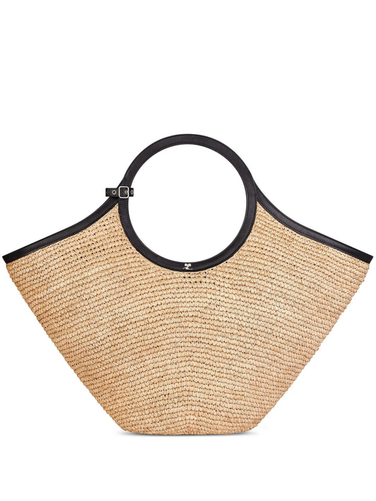 Woven straw tote bag with circular handles and black leather trim